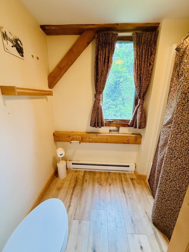 705 Webber St Unit 3, Carrabassett Valley, ME 04947 - full bathroom with a baseboard heating unit and wood finished floors