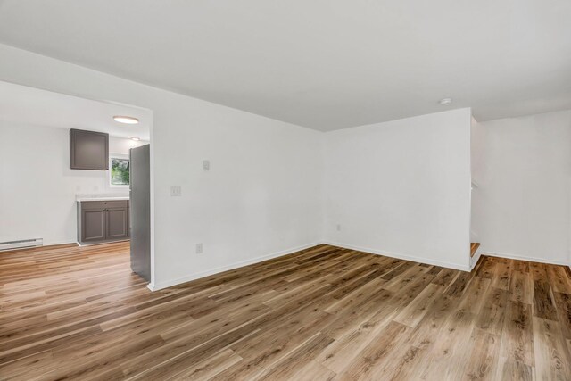 290 Gray Rd, Windham, ME 04062 - spare room with light wood finished floors and a baseboard heating unit