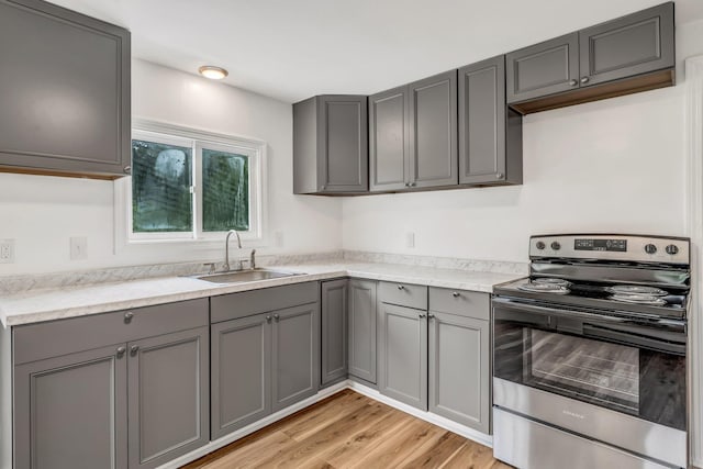 290 Gray Rd, Windham, ME 04062 - kitchen featuring electric stove, gray cabinets, and light wood-type flooring