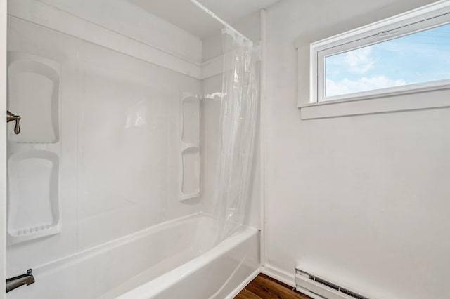 290 Gray Rd, Windham, ME 04062 - full bath with a baseboard heating unit, shower / bath combo, and wood finished floors