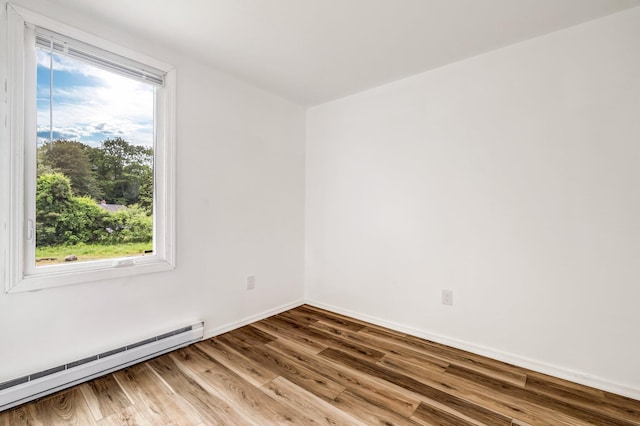 290 Gray Rd, Windham, ME 04062 - spare room with a baseboard heating unit and wood finished floors