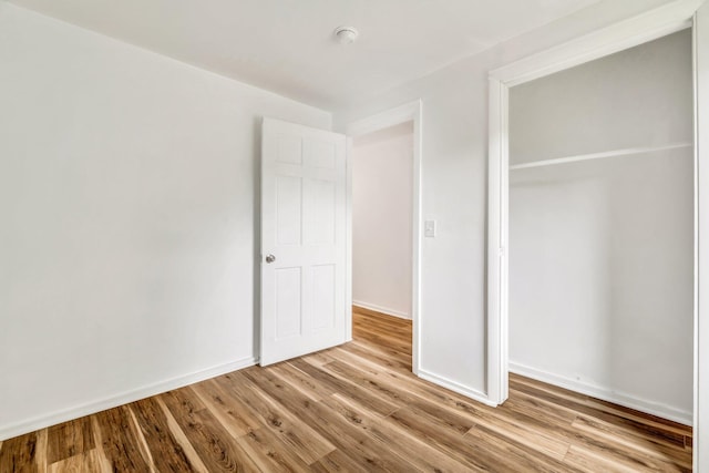 290 Gray Rd, Windham, ME 04062 - unfurnished bedroom featuring light wood-type flooring and a closet