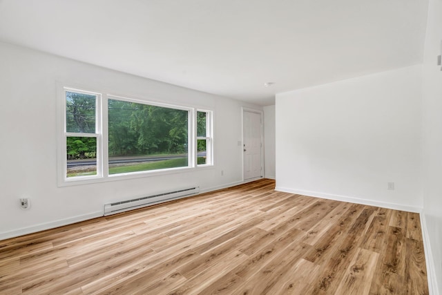 290 Gray Rd, Windham, ME 04062 - unfurnished room with a baseboard radiator and wood finished floors