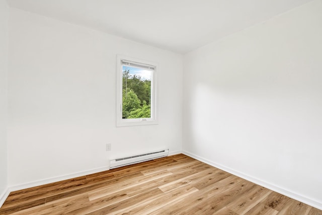 290 Gray Rd, Windham, ME 04062 - empty room with baseboard heating and light wood-style flooring