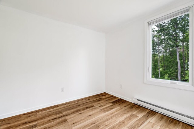 290 Gray Rd, Windham, ME 04062 - unfurnished room with baseboard heating, plenty of natural light, and light wood finished floors