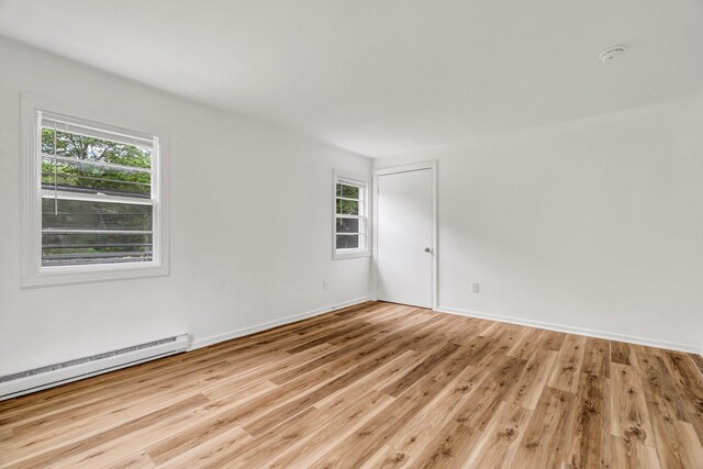 290 Gray Rd, Windham, ME 04062 - unfurnished room featuring a baseboard heating unit, plenty of natural light, light wood-type flooring, and a smoke detector