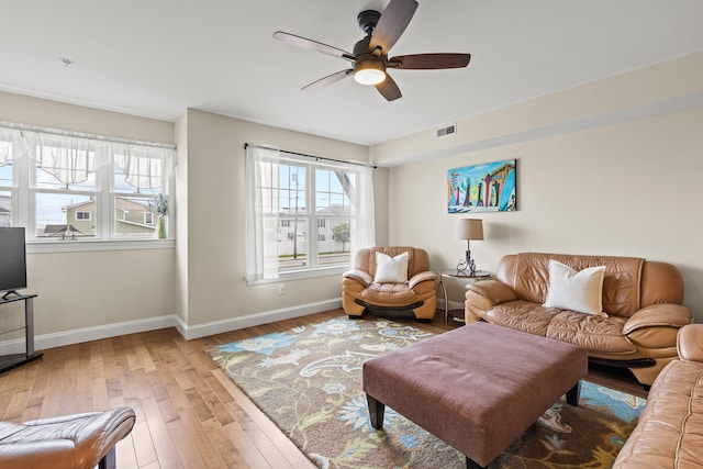 180 E Grand Ave Unit 3, Old Orchard Beach, ME 04064 - living room with light wood-style floors and ceiling fan