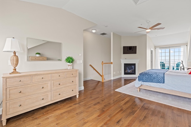 180 E Grand Ave Unit 3, Old Orchard Beach, ME 04064 - bedroom with vaulted ceiling, light wood-type flooring, and a glass covered fireplace
