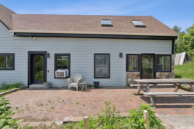 30 Graffam Rd, Baldwin, ME 04091 - back of house featuring a patio, a shingled roof, cooling unit, and outdoor dining area
