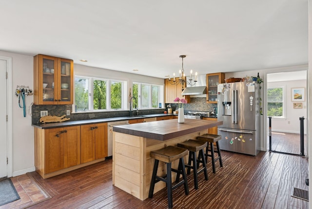 30 Graffam Rd, Baldwin, ME 04091 - kitchen featuring stainless steel appliances, under cabinet range hood, a chandelier, and plenty of natural light