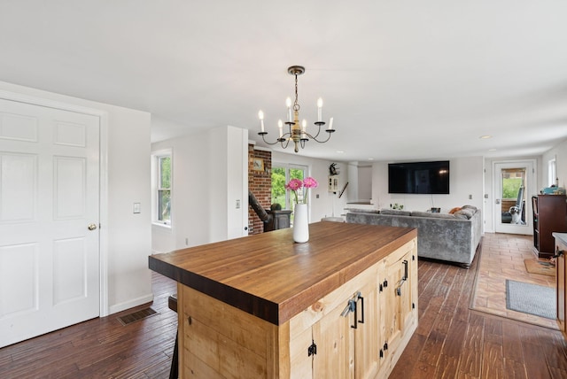 30 Graffam Rd, Baldwin, ME 04091 - kitchen with wood counters, dark wood-style floors, a chandelier, plenty of natural light, and recessed lighting