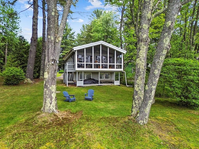 75 Spaulding Point Rd, Belgrade, ME 04917 - view of front of property with a sunroom and a front yard