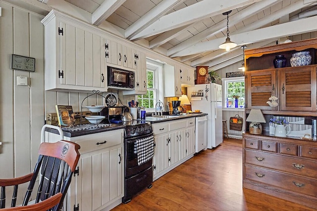 75 Spaulding Point Rd, Belgrade, ME 04917 - kitchen featuring black appliances, dark countertops, wood finished floors, and healthy amount of natural light