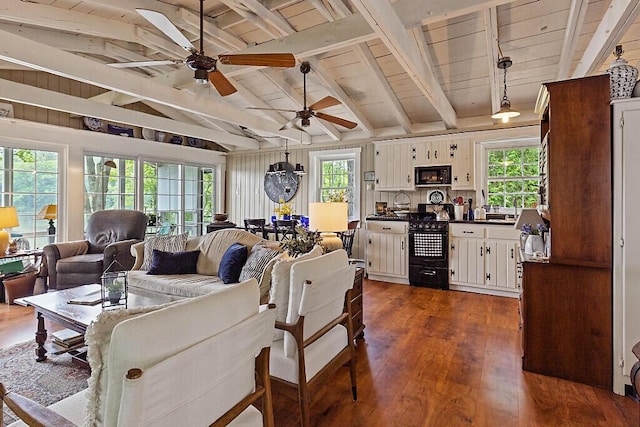 75 Spaulding Point Rd, Belgrade, ME 04917 - living area with dark wood-style flooring, a ceiling fan, wood ceiling, and plenty of natural light
