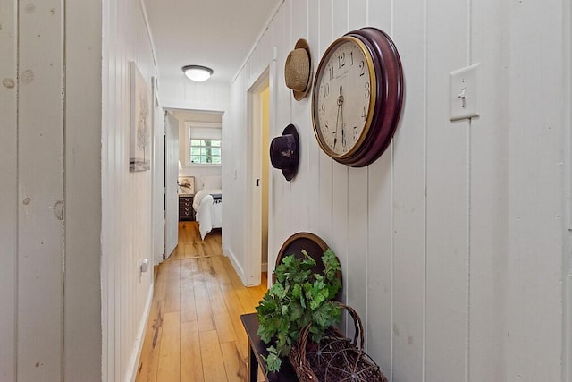 75 Spaulding Point Rd, Belgrade, ME 04917 - hallway featuring light wood finished floors and ornamental molding
