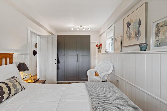 75 Spaulding Point Rd, Belgrade, ME 04917 - bedroom featuring wainscoting