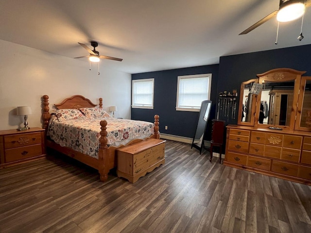 227 Back Rd, Skowhegan, ME 04976 - bedroom featuring dark wood-type flooring, a baseboard heating unit, and ceiling fan