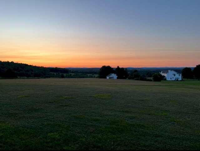227 Back Rd, Skowhegan, ME 04976 - view of green lawn featuring a rural view