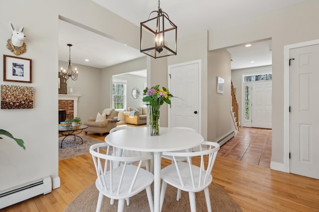24 Cottagewood Ln, Kennebunk, ME 04043 - dining room with baseboard heating, a chandelier, light wood-type flooring, and recessed lighting