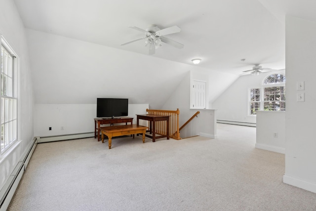 24 Cottagewood Ln, Kennebunk, ME 04043 - living area with ceiling fan, an upstairs landing, a baseboard radiator, carpet floors, and vaulted ceiling