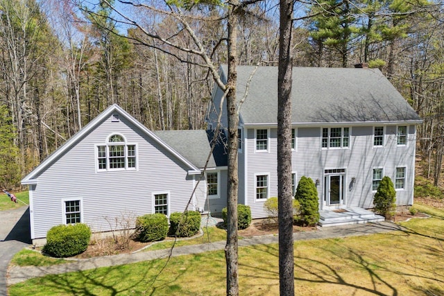 24 Cottagewood Ln, Kennebunk, ME 04043 - view of front of property with a front lawn and a chimney
