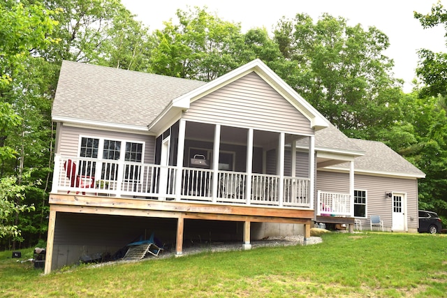 171 Hancock Pond Rd, Sebago, ME 04029 - back of property featuring roof with shingles, a lawn, a sunroom, and a deck