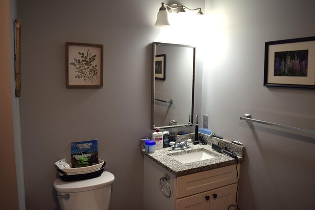 171 Hancock Pond Rd, Sebago, ME 04029 - bathroom with toilet and vanity