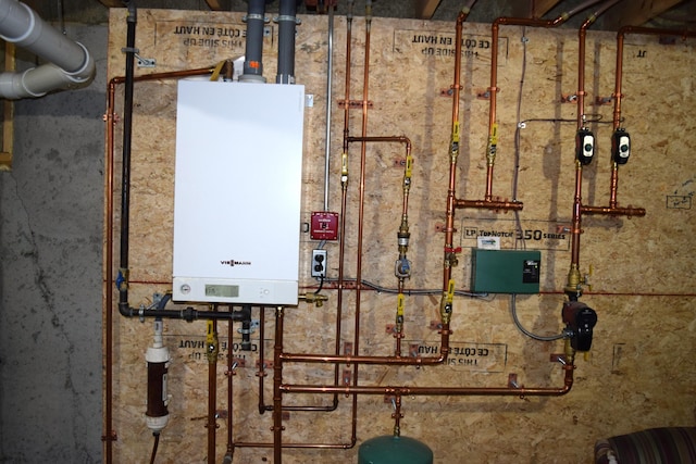 171 Hancock Pond Rd, Sebago, ME 04029 - utility room featuring tankless water heater