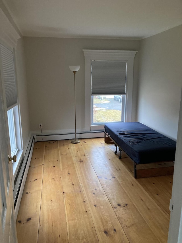 11 Gardner Ave, Machias, ME 04654 - bedroom with a baseboard radiator and light wood finished floors