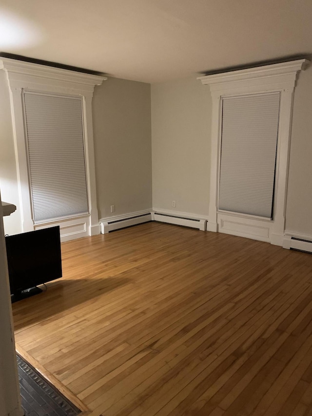11 Gardner Ave, Machias, ME 04654 - unfurnished living room with wood finished floors and a baseboard radiator