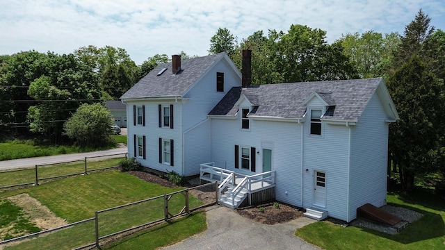 11 Gardner Ave, Machias, ME 04654 - view of front of house featuring a chimney, a gate, and driveway