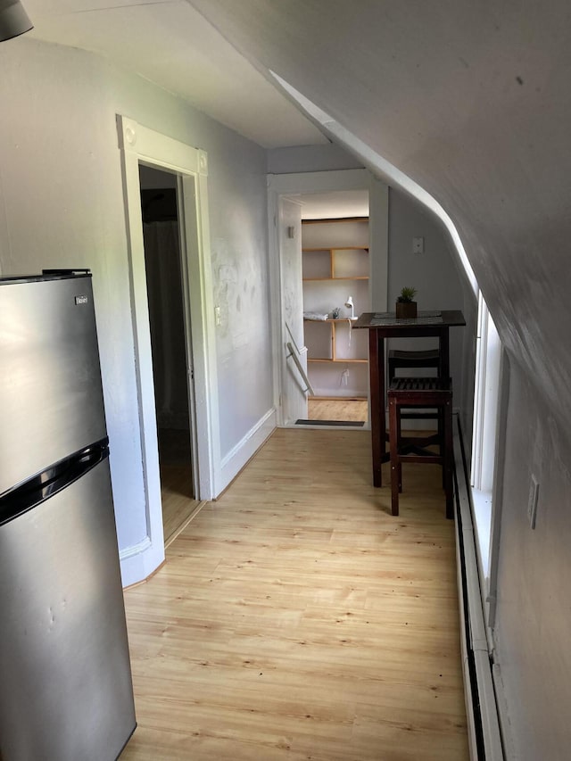 11 Gardner Ave, Machias, ME 04654 - corridor with light wood-style floors and lofted ceiling