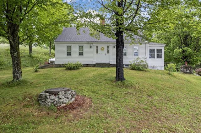 507 Ford Quint Rd, North Berwick, ME 03906 - rear view of house featuring a yard, a chimney, a fire pit, and roof with shingles