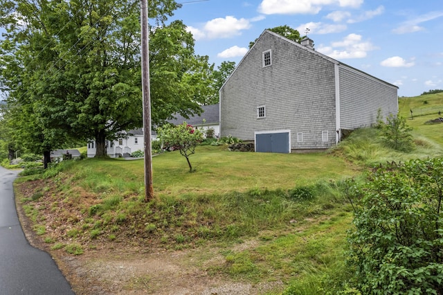 507 Ford Quint Rd, North Berwick, ME 03906 - view of side of property with a chimney and a yard