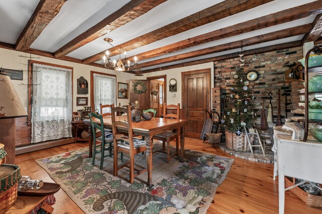 507 Ford Quint Rd, North Berwick, ME 03906 - dining area featuring a chandelier, beam ceiling, hardwood / wood-style flooring, and a baseboard heating unit