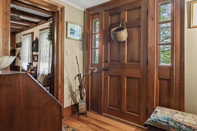 507 Ford Quint Rd, North Berwick, ME 03906 - entryway featuring healthy amount of natural light, light wood-style flooring, wallpapered walls, and beamed ceiling