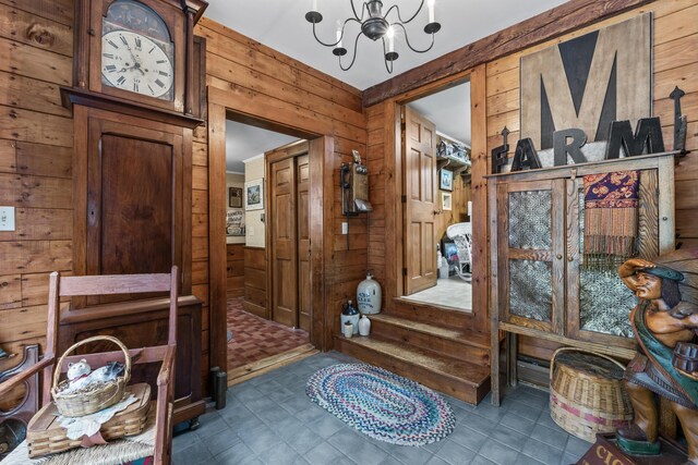 507 Ford Quint Rd, North Berwick, ME 03906 - foyer entrance featuring wooden walls and a chandelier