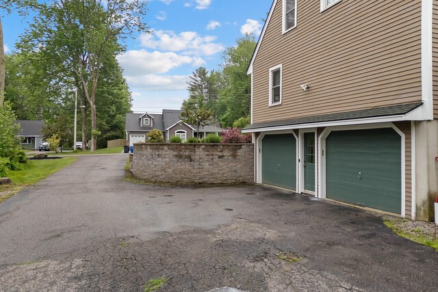 26 Ferncroft Rd, York, ME 03909 - view of home's exterior with a garage and driveway