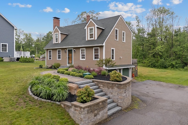 26 Ferncroft Rd, York, ME 03909 - cape cod-style house with a chimney, a front lawn, and roof with shingles