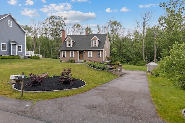 26 Ferncroft Rd, York, ME 03909 - cape cod-style house with a chimney, a front lawn, and an outdoor structure