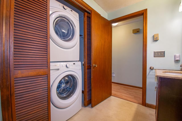 24 Down E Ln, Scarborough, ME 04074 - washroom with estacked washer and dryer and light floors