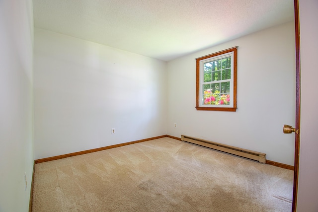 24 Down E Ln, Scarborough, ME 04074 - carpeted empty room featuring a baseboard radiator and a textured ceiling