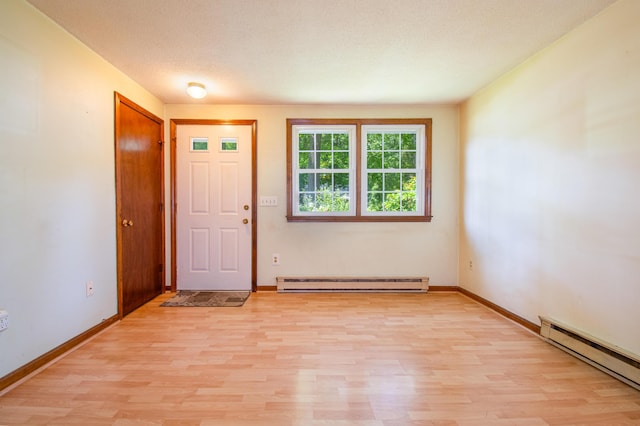 24 Down E Ln, Scarborough, ME 04074 - foyer featuring a baseboard radiator, light wood-type flooring, and a textured ceiling