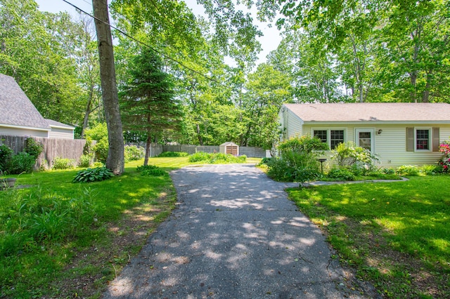 24 Down E Ln, Scarborough, ME 04074 - view of front of house with a storage unit and driveway