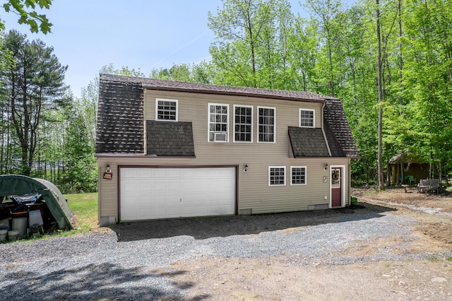 627 Green Lake Rd, Dedham, ME 04429 - dutch colonial with a shingled roof, a garage, and a gambrel roof