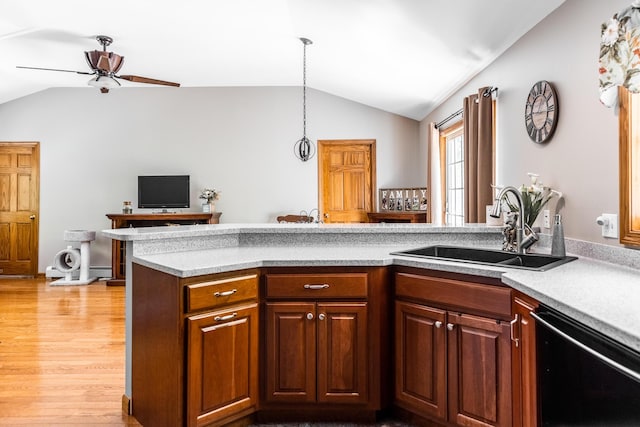 627 Green Lake Rd, Dedham, ME 04429 - kitchen featuring vaulted ceiling, dishwasher, ceiling fan, light countertops, and light wood-type flooring