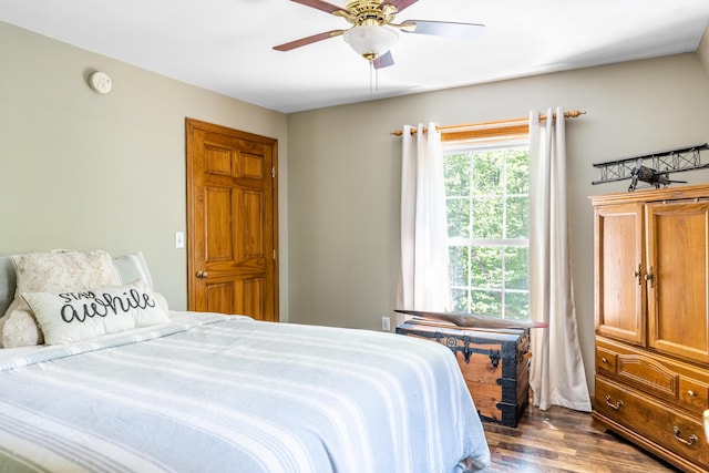 627 Green Lake Rd, Dedham, ME 04429 - bedroom with dark wood finished floors and ceiling fan