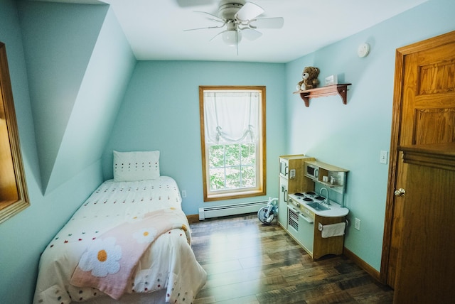 627 Green Lake Rd, Dedham, ME 04429 - bedroom with a baseboard heating unit, dark wood-style flooring, and ceiling fan