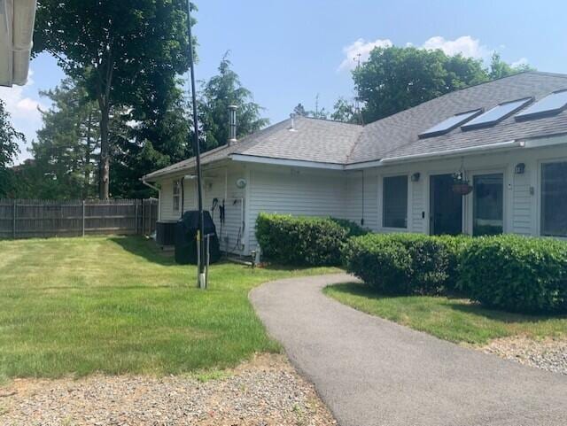 48 13th St, Bangor, ME 04401 - view of property exterior featuring roof with shingles