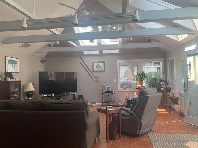 48 13th St, Bangor, ME 04401 - living area featuring a skylight and light tile patterned floors